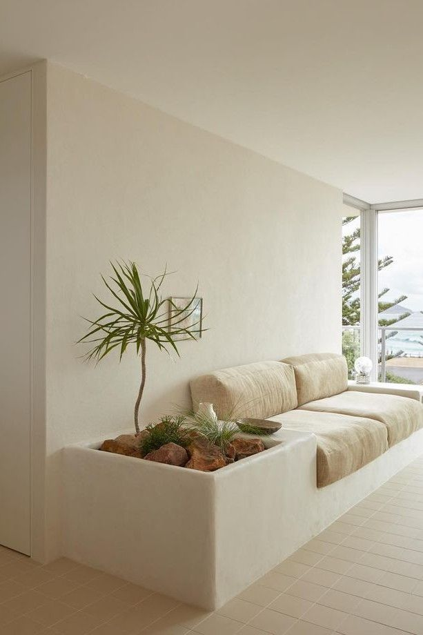 Patio seating inspiration: a built-in cream bench beside an integrated planter
